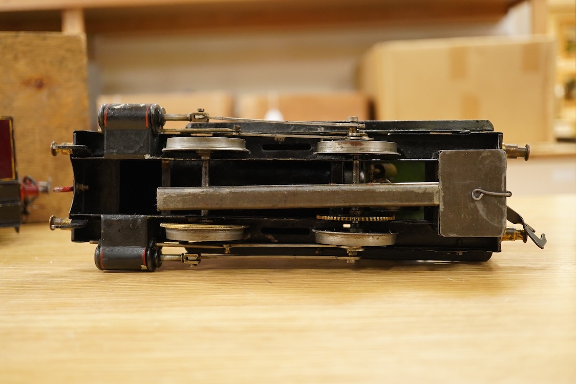 An early 20th century Gauge One Bing live steam 0-4-0T ‘I48’ locomotive, with a spirit fired pot boiler, driving a single oscillating vertical cylinder mounted in the cab, with twin outside dummy cylinders, the regulator